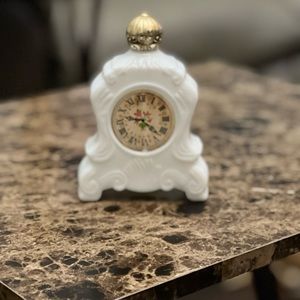 Vintage milk glass Avon mantle clock.